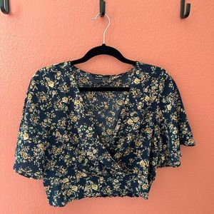 Two floral sleeved crop tops